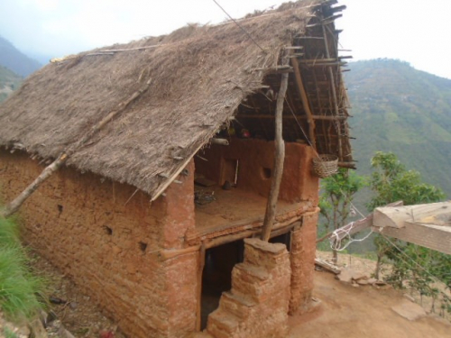 The cowshed outside Kamana’s house does little to protect her from the elements and attacks from wild animals.